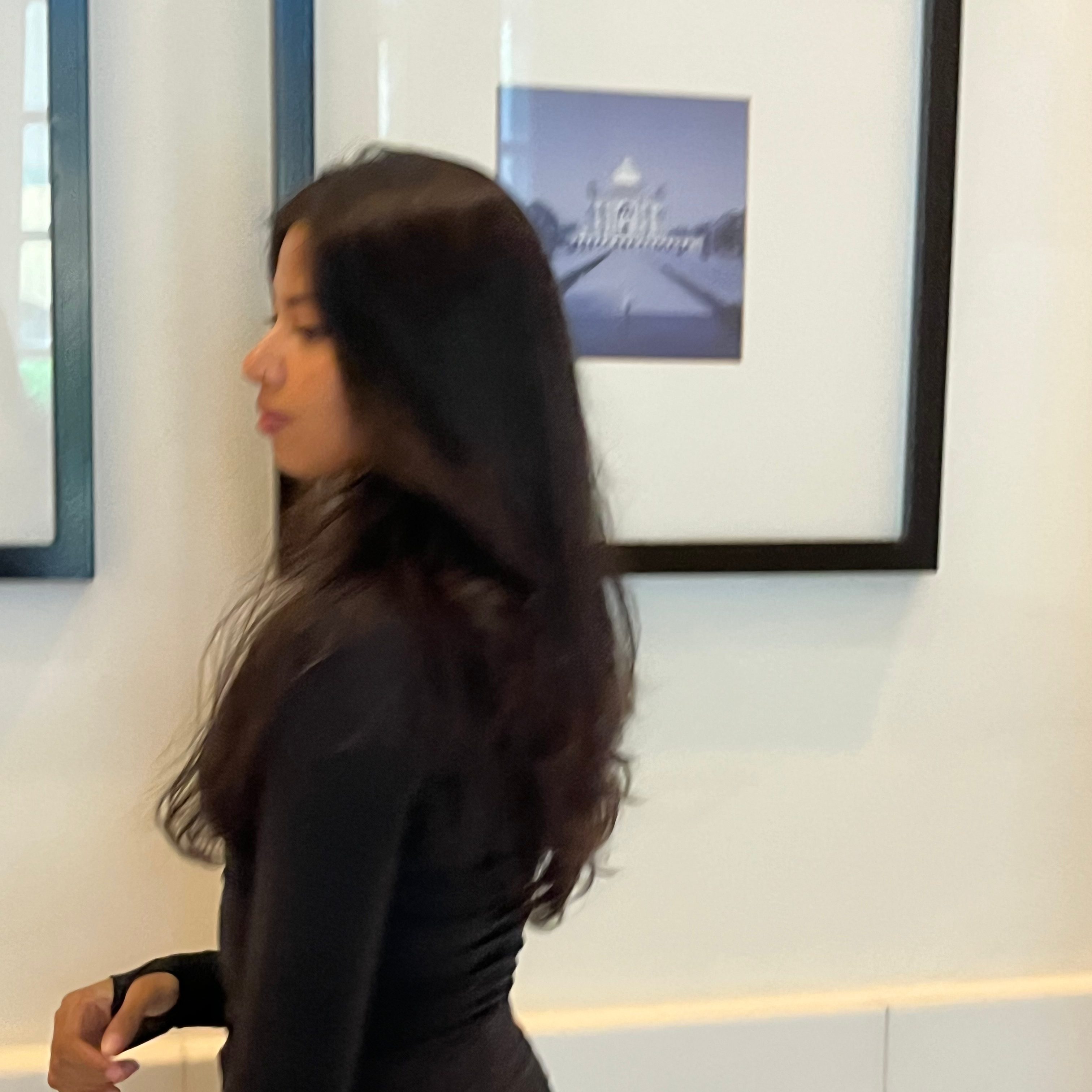 email for bloggers - a girl dressed in all black, against a white wall with a picture frame